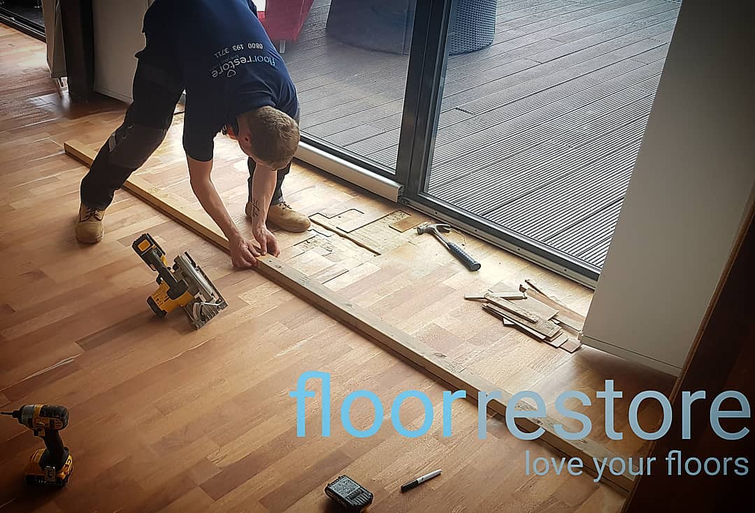 Engineered wood floor being repaired